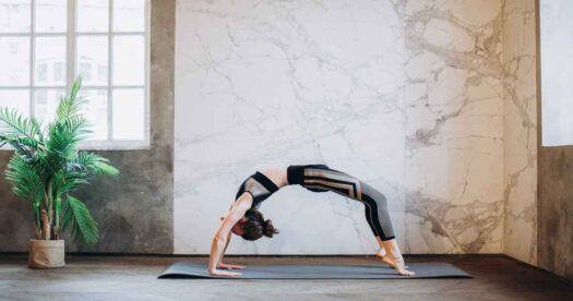 This image of Yoga Burn reviews is an image of a girl stretching backwards as a part of Yoga.